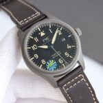 A wristwatch with a black dial and green accents on the strap.