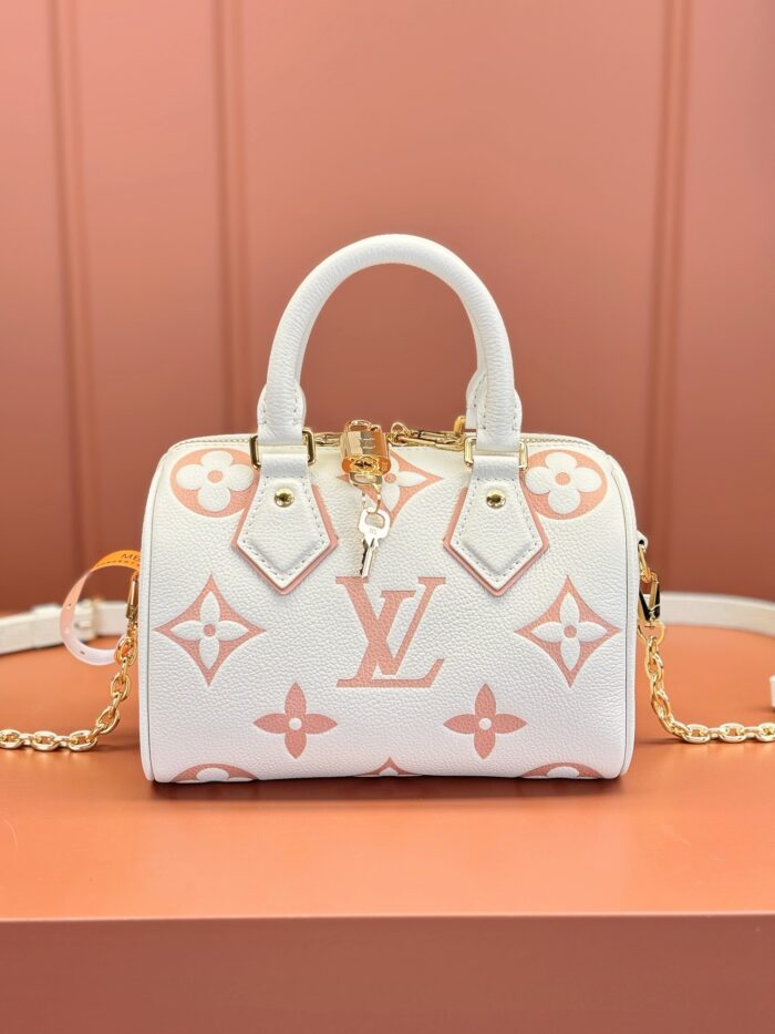 White Louis Vuitton handbag with pink and white monogram pattern, gold lock charm, and chain strap.